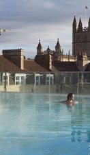 Woman swimming in a swimming pool at a spa